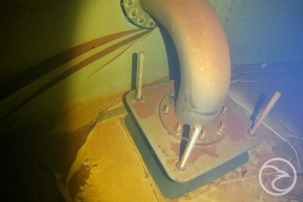 internal view of a steel water tank with corrosion damage